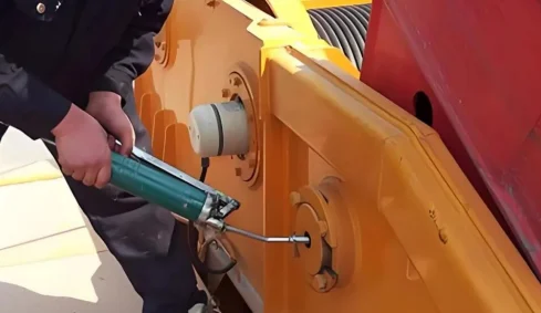 Add lubricating grease to rotating parts