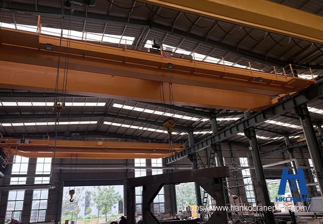 Close-up inspection of a heavy-duty crane hook with safety latch as part of a daily crane safety checklist