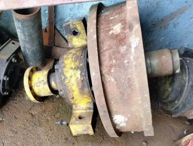 Crane wheel exhibiting one-sided flange wear and alignment issues