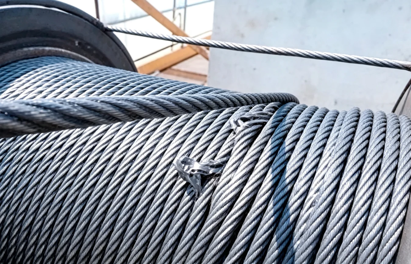 Damaged crane wire rope showing broken wires and wear
