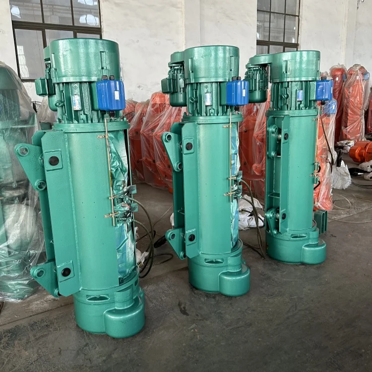 Electric hoist pendant control switch being inspected by an operator
