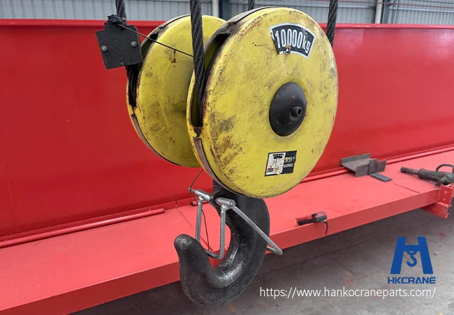 Industrial overhead crane hook in action during heavy-duty lifting operations