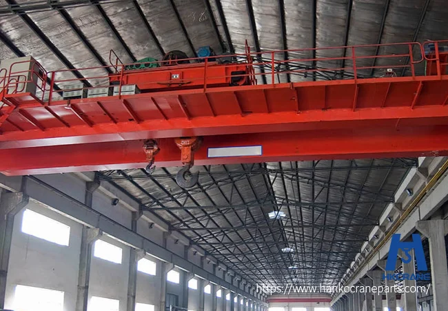Heavy duty overhead crane operating in a steel plant industrial workshop