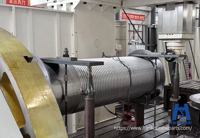 CNC vertical lathe machining a large crane drum in the workshop