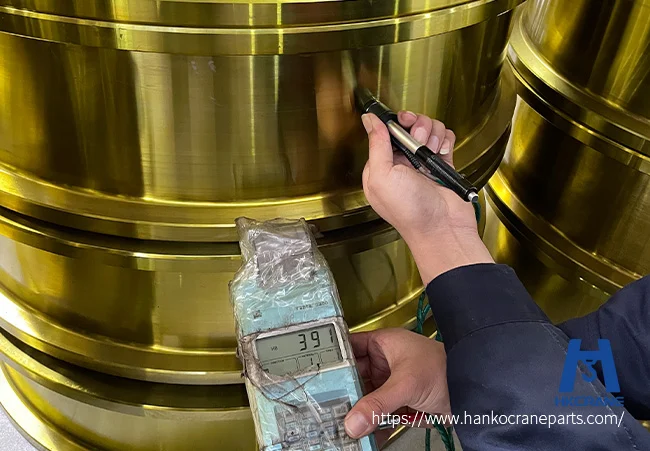 Portable hardness tester checking a crane wheel tread in the Hanko workshop