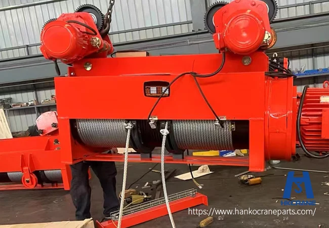 Electric hoist wire rope replacement with new rope spooled on drum